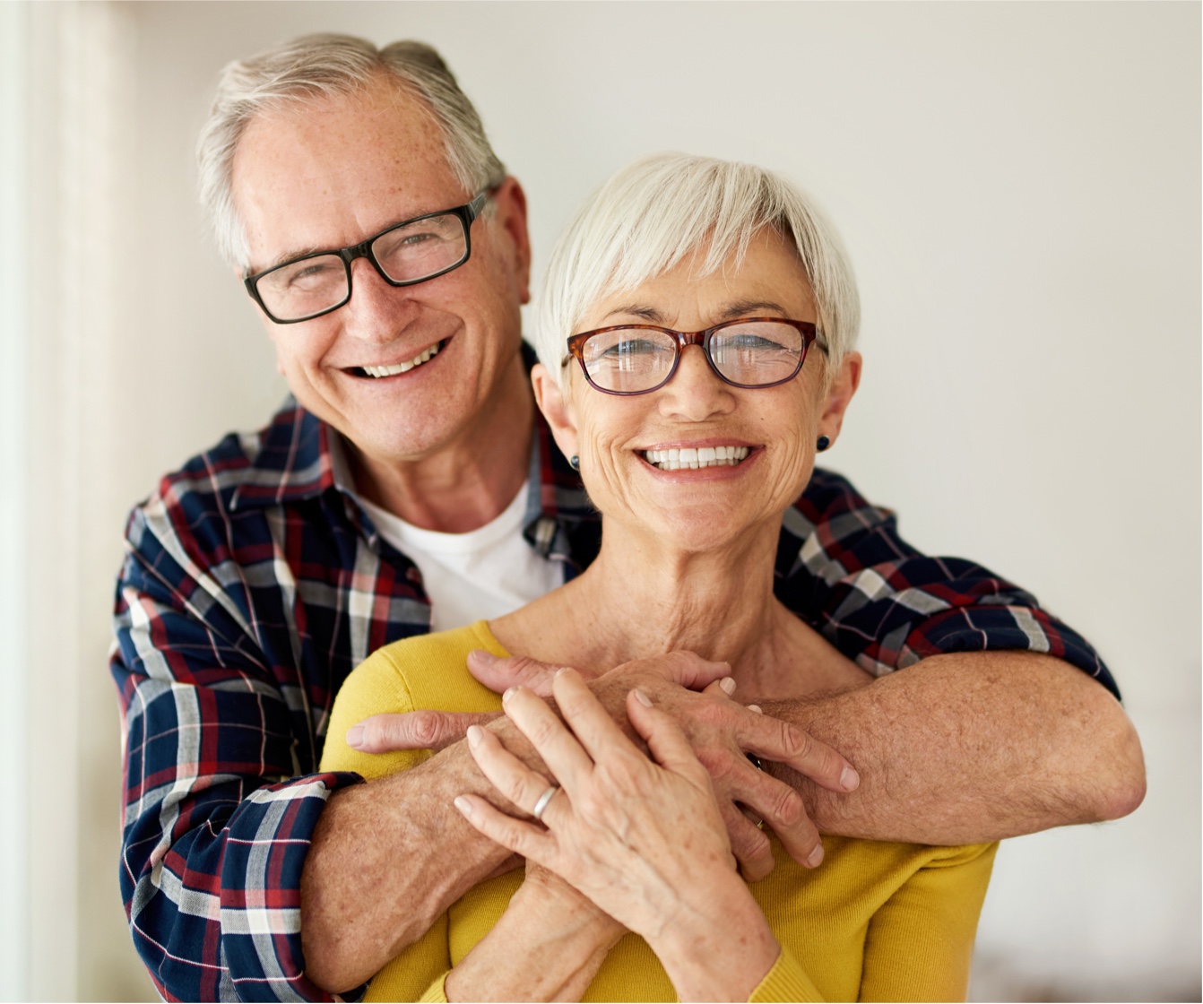 Older adult man and woman in an embrace