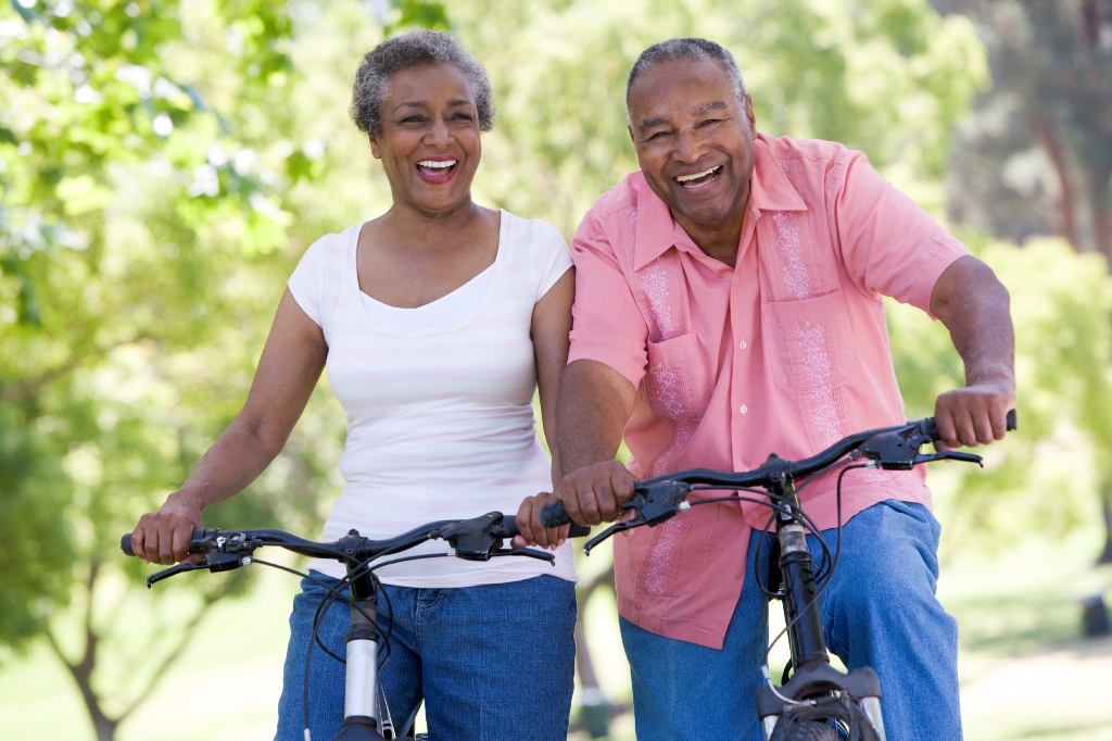 older adult man and woman on cycle ride