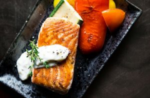 rectangular plate of grilled salmon and vegetables