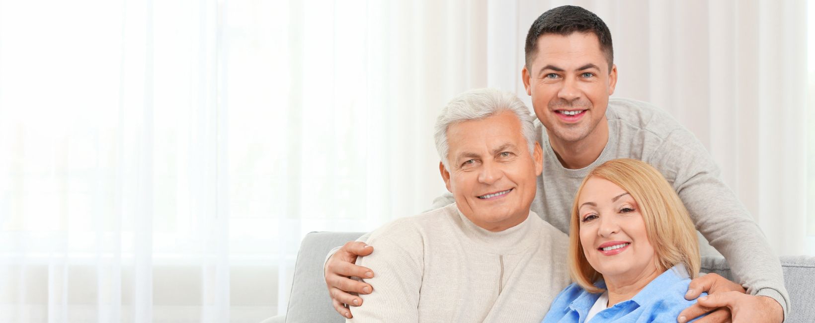 adult child with senior parents discussing life planning